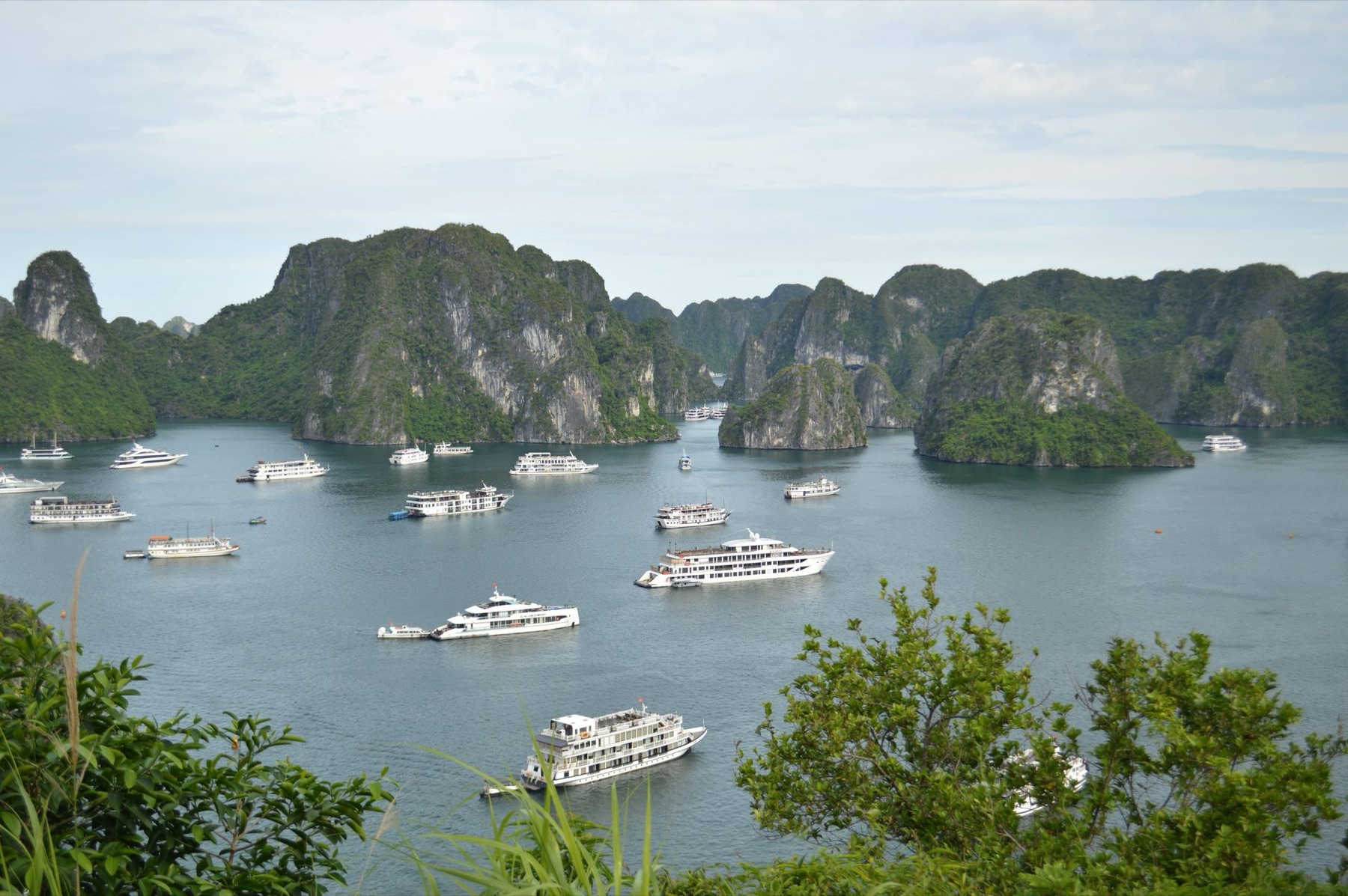 Ha Long Bay — Explore the stunning limestone islands and cruise boats of Ha Long Bay, Vietnam.