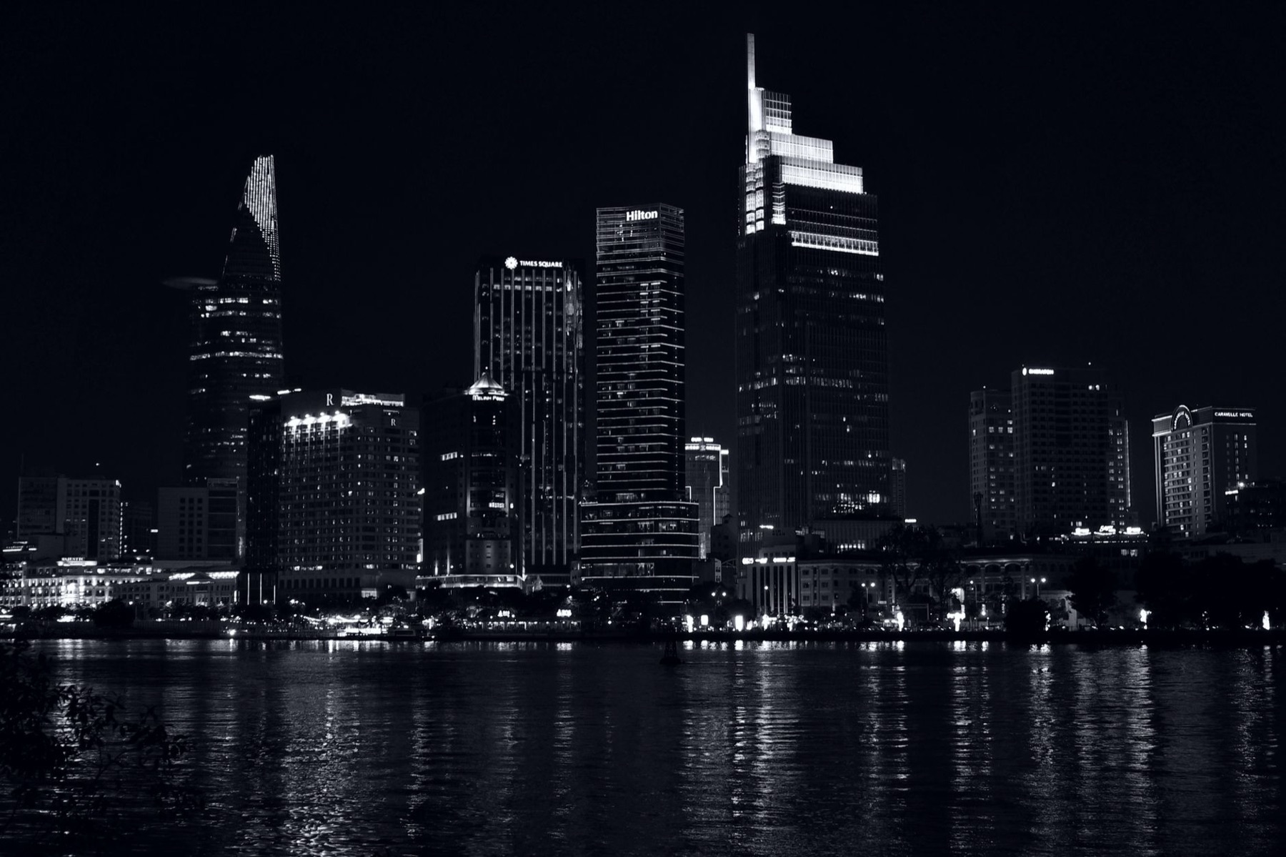 Ho Chi Minh City — Monochrome night view of Ho Chi Minh City skyscrapers reflecting on the Saigon R