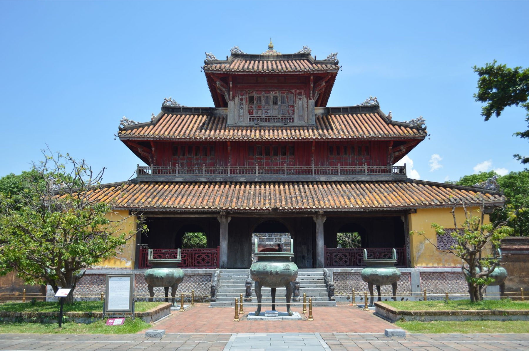 Hue — Beautiful Vietnamese pagoda with traditional architecture under a clear blue sky