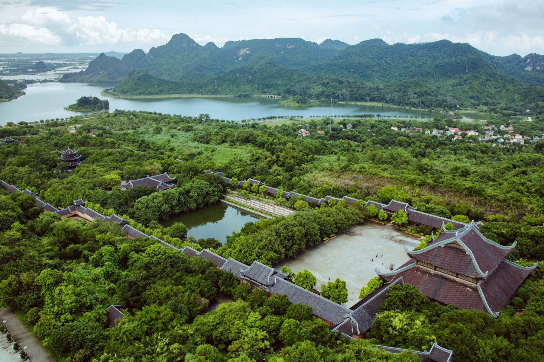 Ninh Binh — Scenic aerial shot of Bai Dinh Temple in Vietnam surrounded by lush greenery and