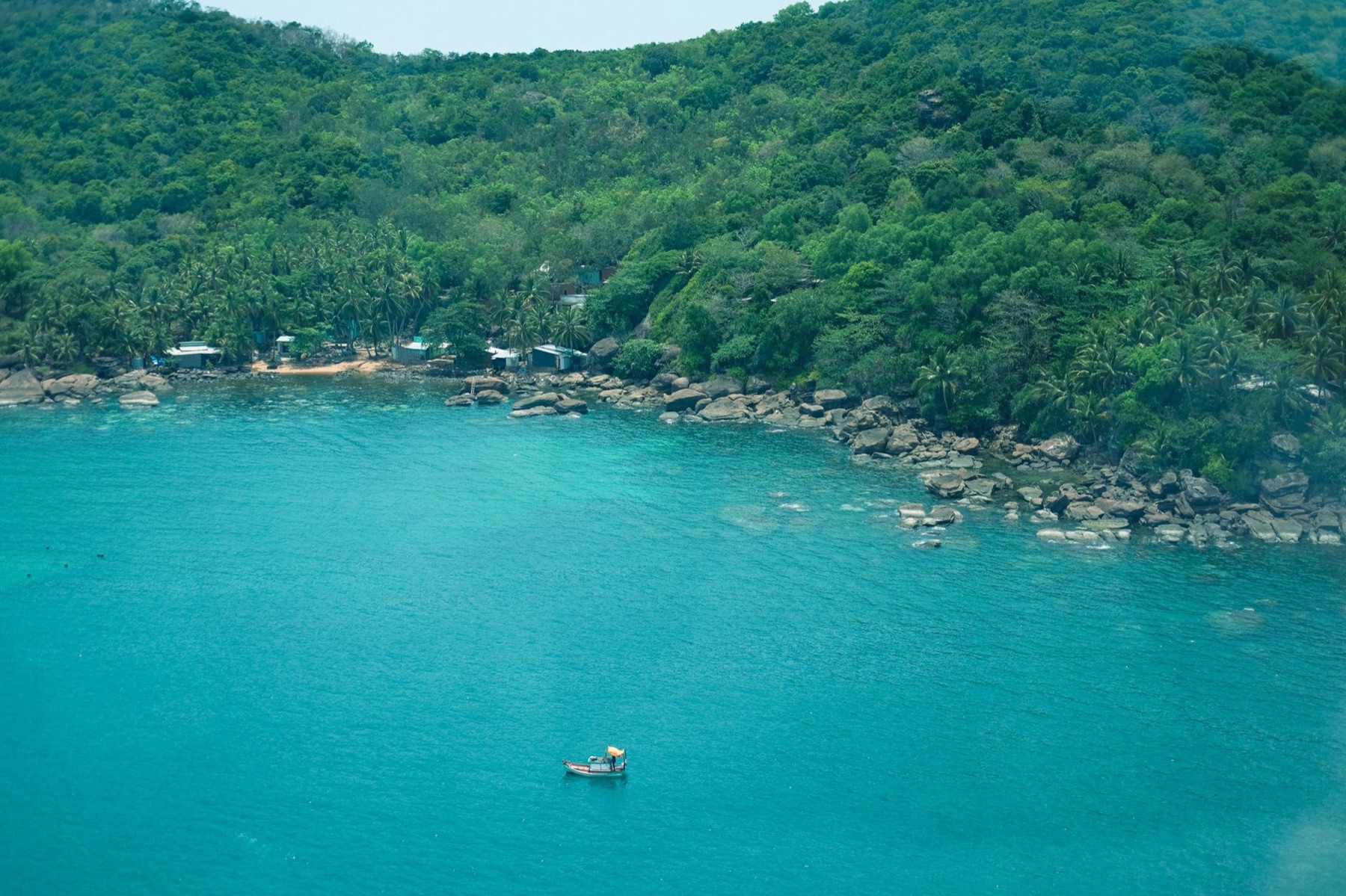 Phu Quoc — A picturesque aerial view of Phu Quoc island's tropical coastline with lush gree