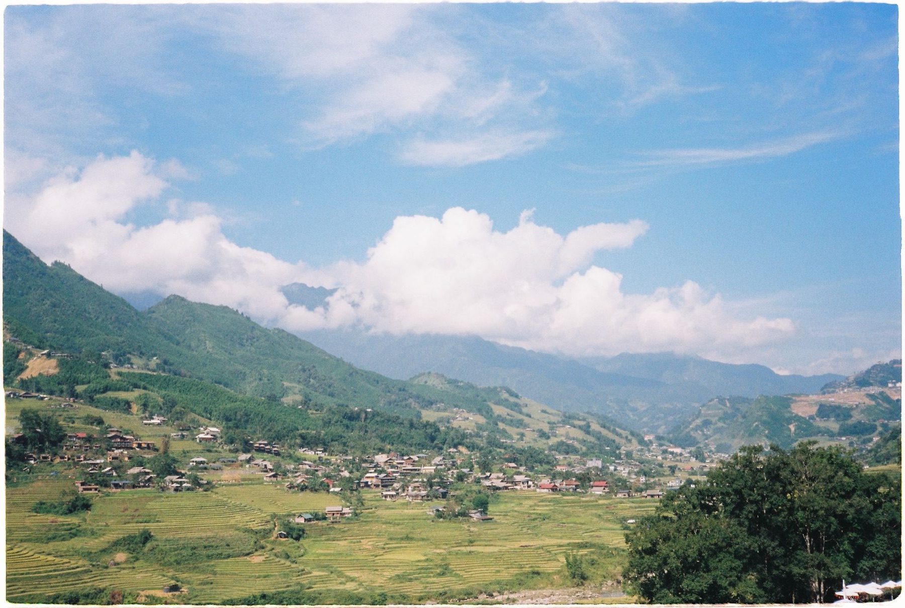 Sapa — A beautiful landscape of Sapa rice terraces with a village nestled amongst green